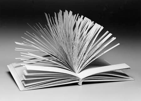 An open book with pages cut into narrow horizontal strips, each strip holding one line of a sonnet that can be flipped independently.