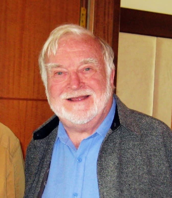 Portrait photograph of psychologist Mihály Csíkszentmihályi, an older man with a white beard.